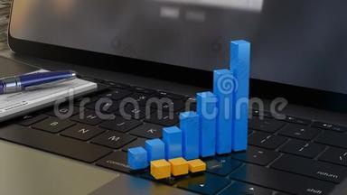笔记本电脑键盘上的3D财务图表、财务统计、分析